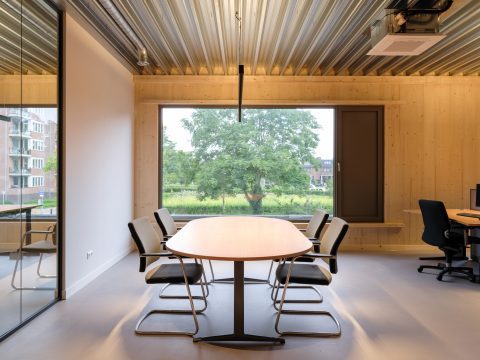 Veterinary clinic office workspace with social space and desks, CLT wood walls. Veterinary clinic design for Anicure ‘t Leidse Land in Leiderdorp, designed and built by MOST Architecture, Rotterdam