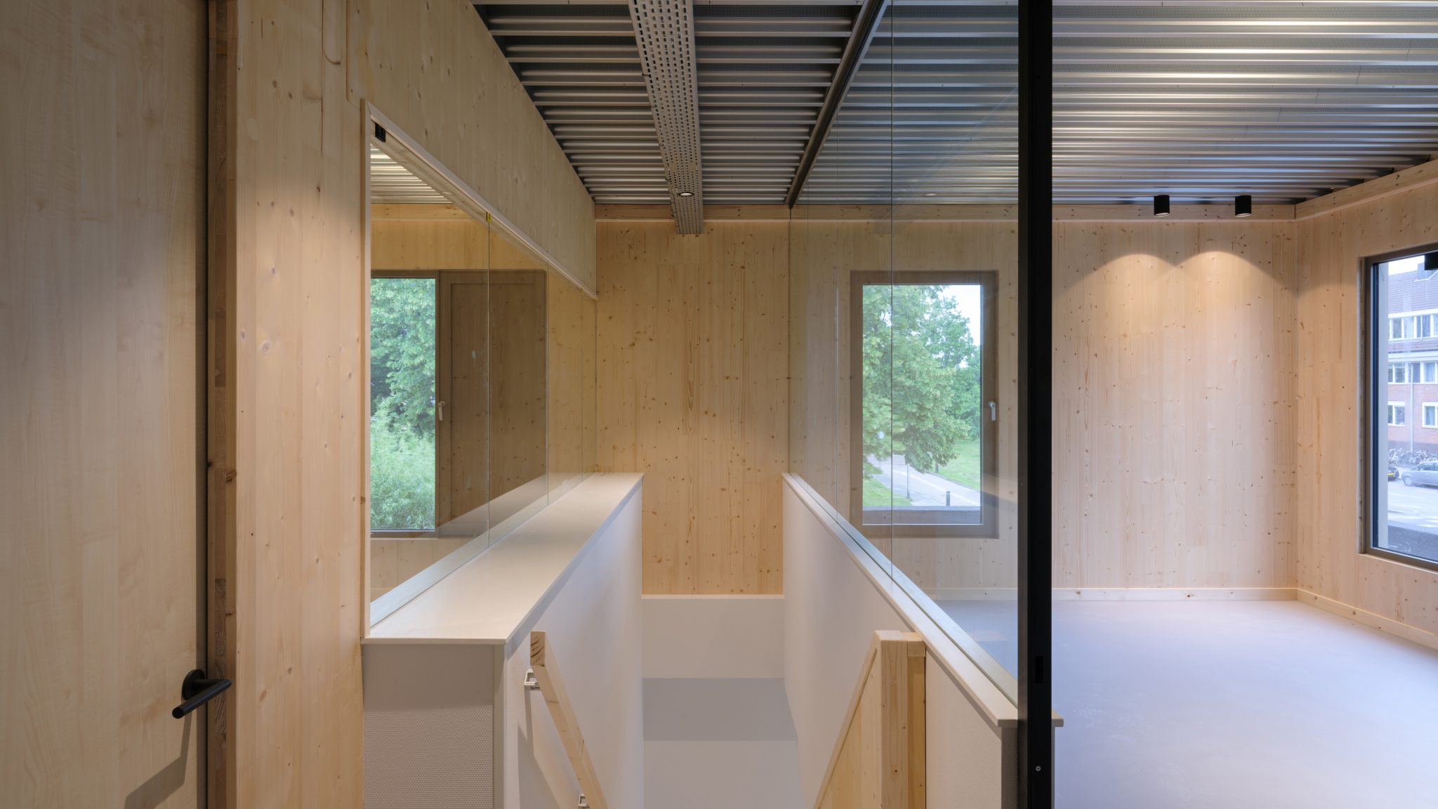 Interior view of CLT extension of Anicura Dierenkliniek Leidse Land Leiderdorp with galvanized steel ceiling and CLT wall define wooden atmosphere interior design by MOST Architecture Rotterdam