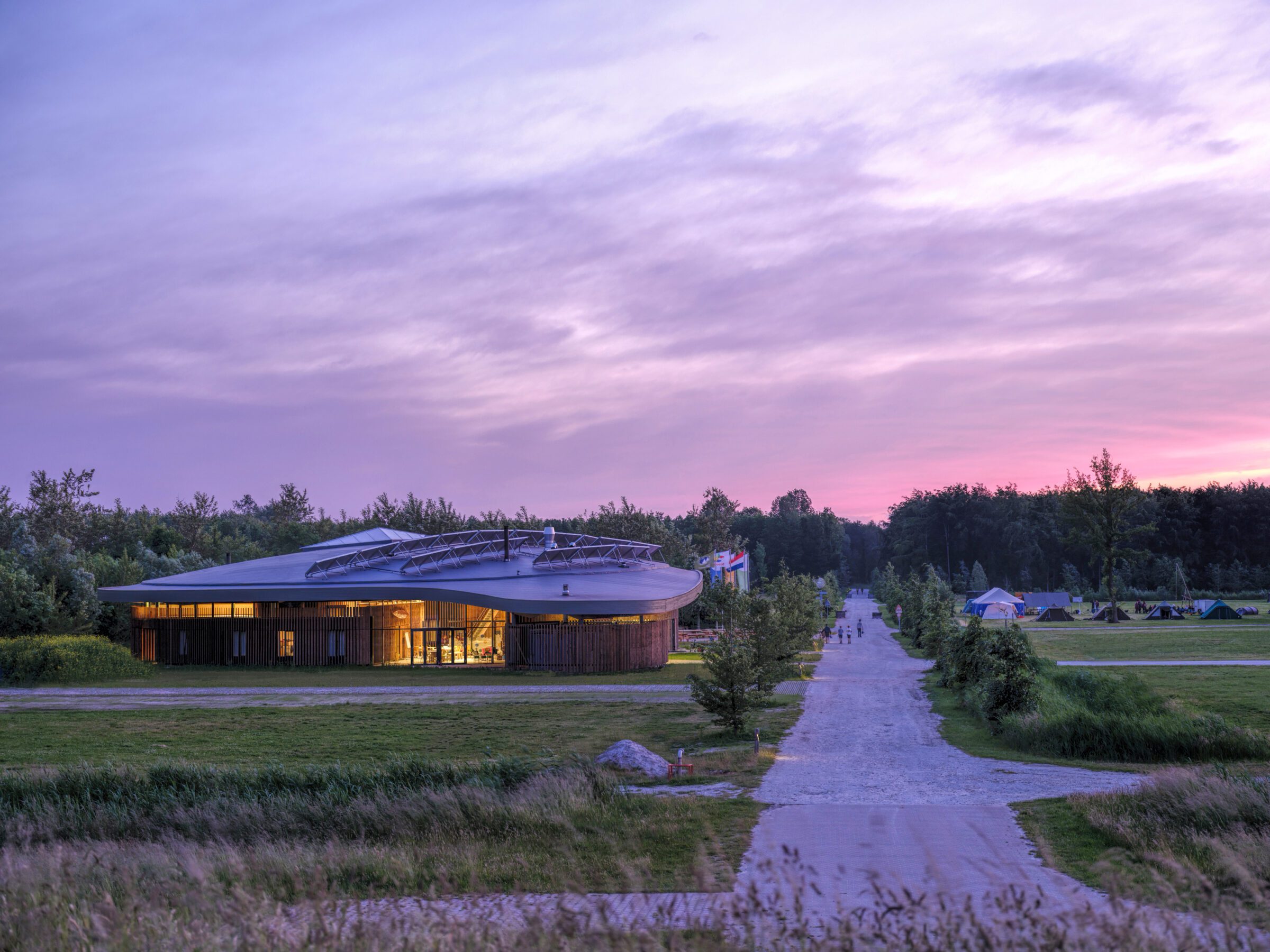 Evening view of the Adventure house on Scoutinglandgoed Zeewolde a design by MOST Architecture